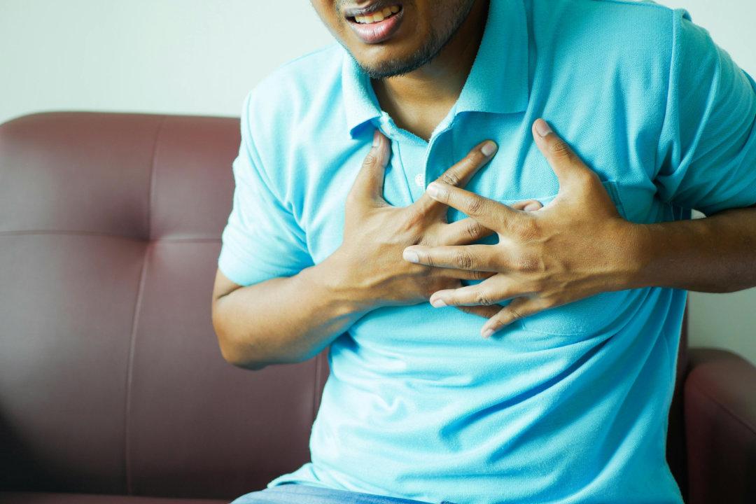 A medical professional reviewing a cardiac scan with advanced technology equipment.